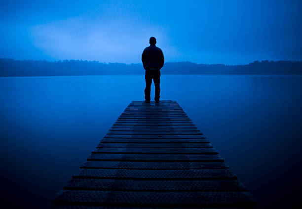 istock Lonley man stood at the end of a Pier 108312471