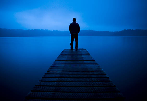 Lonley man stood at the end of a Pier  suicide photos stock pictures, royalty-free photos & images