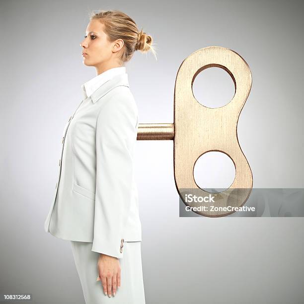 Beautiful Windup Toy Businesswoman Stock Photo - Download Image Now - Beautiful People, Beauty, Blond Hair