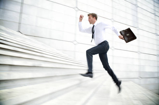 istock Businessman Running Up White Staircase 108312695