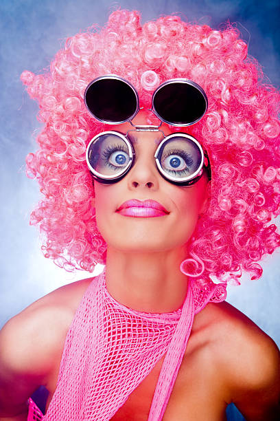 glamorous woman in pink dress wig bright makeup. High quality photo