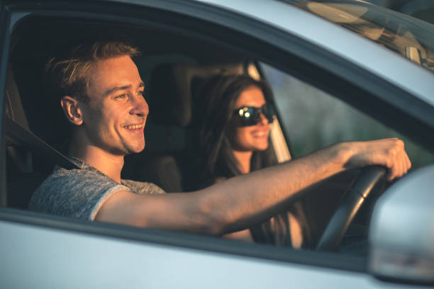istock The young couple drive a car 1083140076