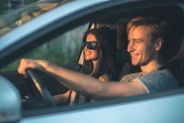 istock The happy couple drive a car 1083140078