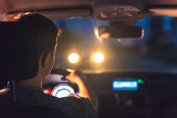 istock The man drive a car. evening night time 1083140112