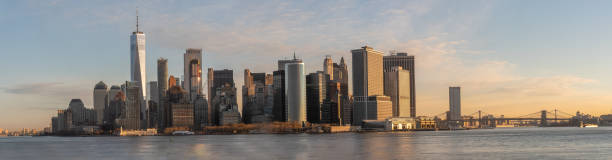 istock Panoramic View of Manhattan Skyline During Sunrise From the Water 1083143048
