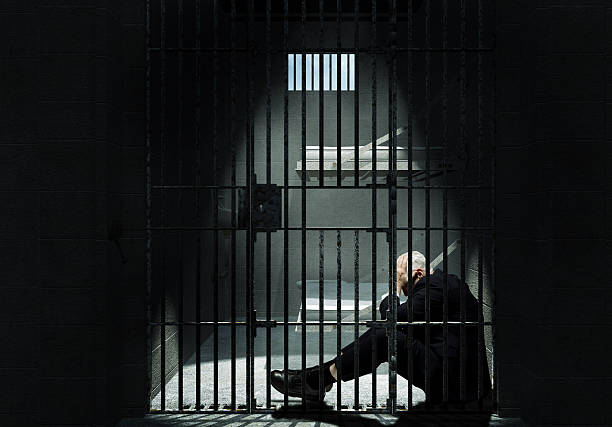 istock Businessman sitting in Jail 108314376