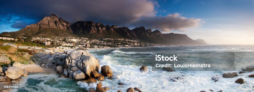 Panorama shot of the Twelve Apostles on a very cloudy day A late afternoon panoramic of the Twelve Apostles and Camps Bay in Cape Town. Hout Bay Stock Photo