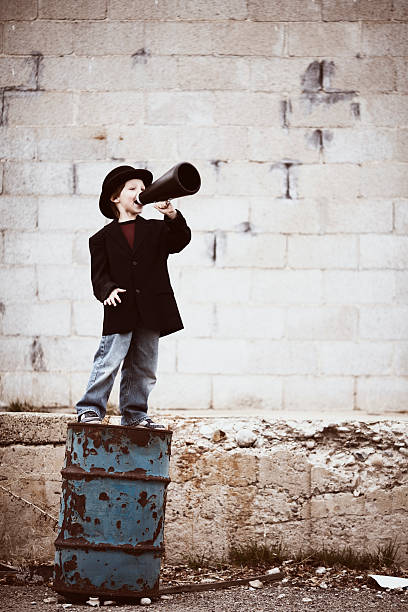 istock Young Boy Salesman Yells Through Megaphone 108315028