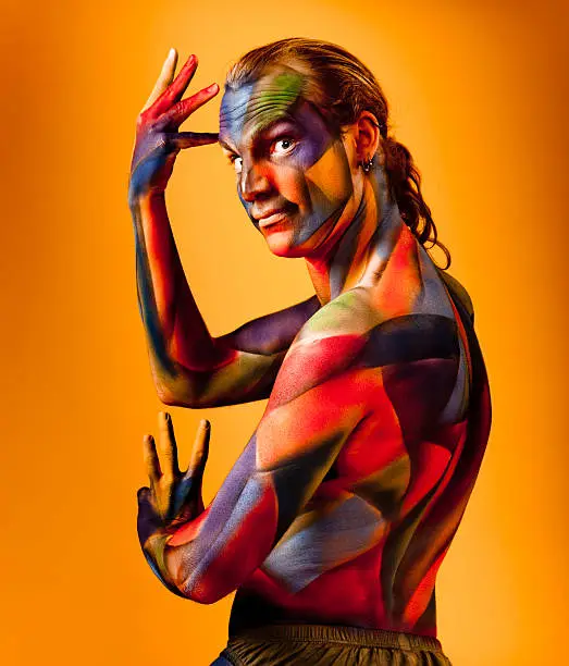 Man airbrushed with colorful cubism body paint. I am the artist.