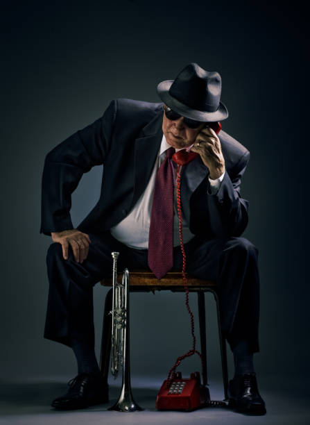 istock old jazz musician answering a phone call 108315738