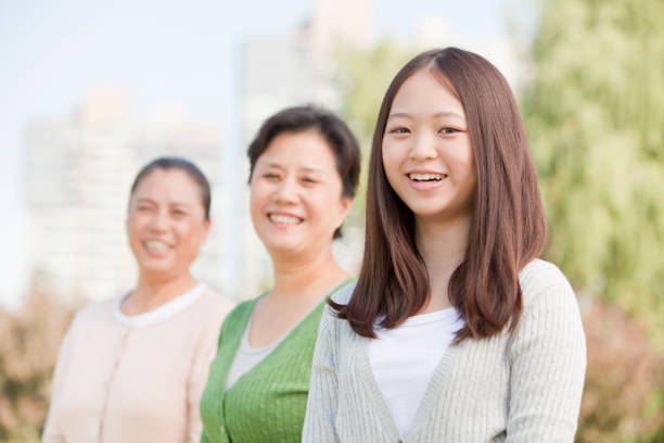 istock Chinese family smiling in park 1083159224