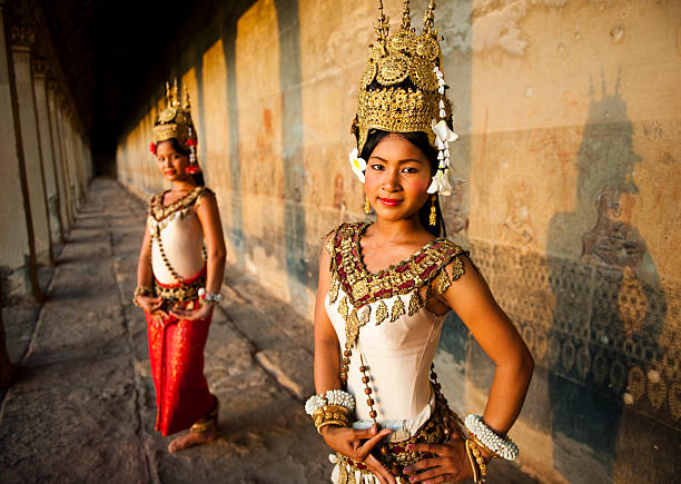 Siem Reap, Cambodia - December 10, 2013: Tourists walking the path to and from the main temple at Angkor Wat outside Siem Reap.