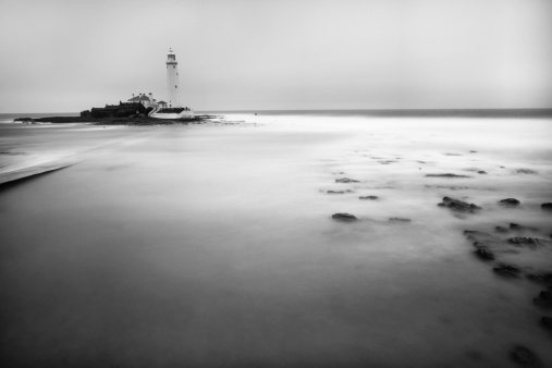 3.5 minute long exposure at of St Mary's Lighthouse in Whitley Bay, Tyne and Wear, UK. Converted to black and white and grain added.