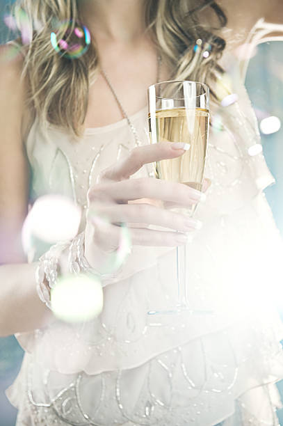 istock woman with champagne glass 108316621