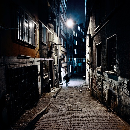 Big city, dark alley.