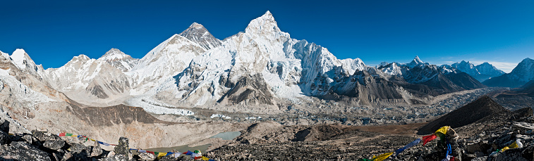 Clouds rising from the Ngozumpa glacier frame this ethereal image of a stunning Himalayan panorama visible from the summit of Gokyo Ri in Nepal