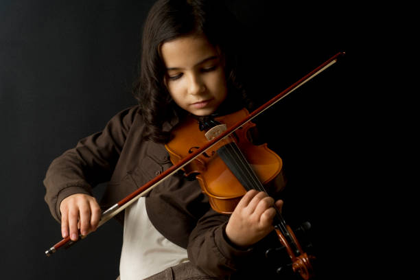 little girls violinist stock photo