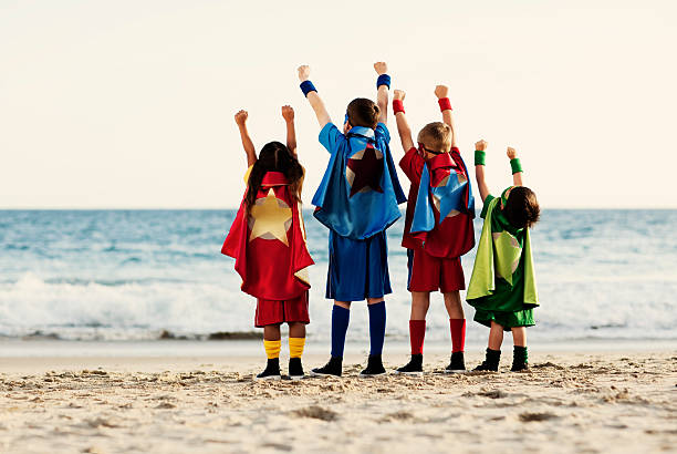 superhero zasilania - superhero child partnership teamwork zdjęcia i obrazy z banku zdjęć
