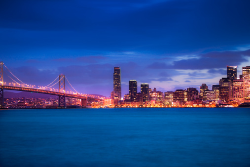 Skyline of San Francisco with Bay bridge at night