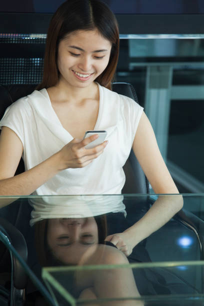 istock Chinese businesswoman using cell phone in office 1083200574