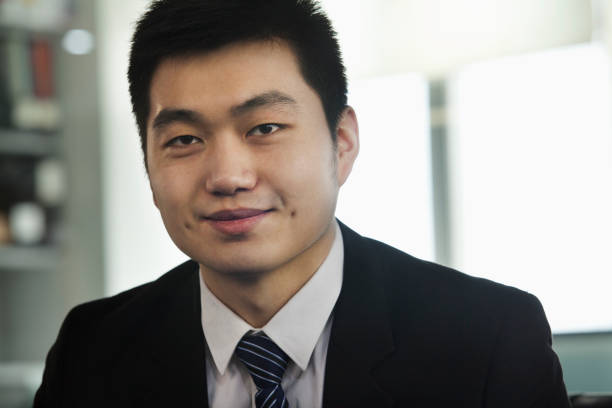 istock Chinese businessman smiling in office 1083200702