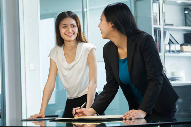 istock Chinese businesswomen smiling in office 1083200742