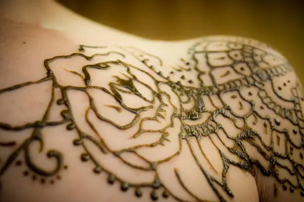 A rose tattoo from natural brown henna.