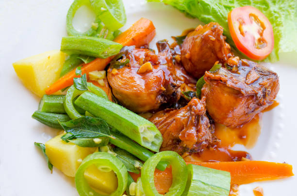 istock on a white plate food meat with sauce and vegetables 1083204898