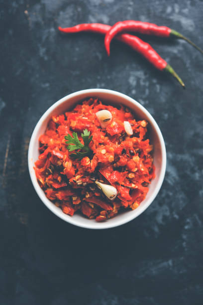 istock Hot and spicy red chilli chutney using lal mirch, cumin seeds, lemon juice and coriander. served in a bowl. selective focus 1083209234