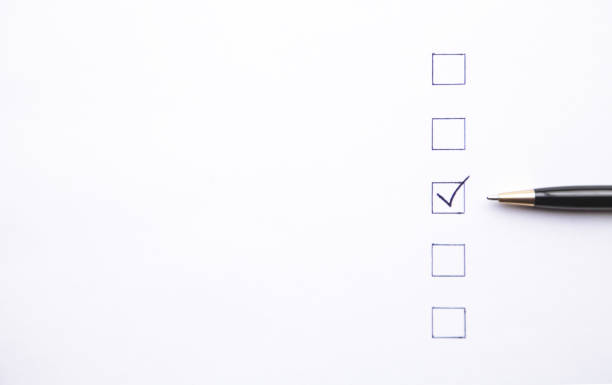 istock Pen and Checklist on white paper. Business concept 1083212464