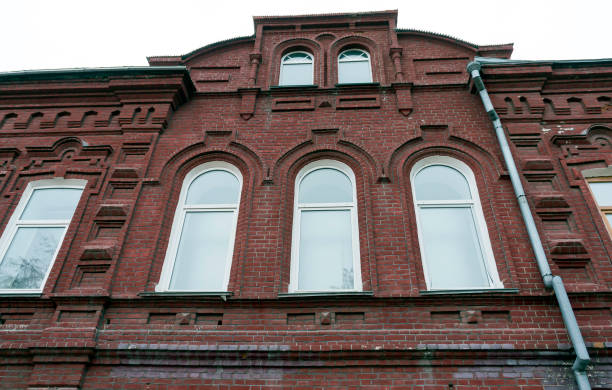 istock facade of an old brick building 1083212514