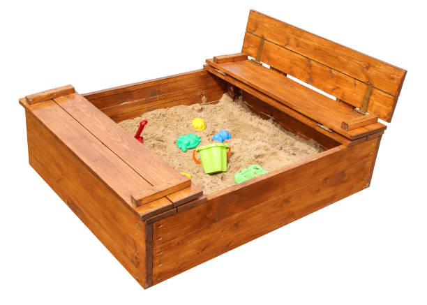 Wooden children sandbox with toys. Isolated on white background Wooden children sandbox with toys. Isolated on white background sandbox photos stock pictures, royalty-free photos & images