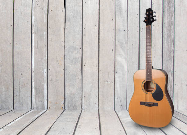 istock Wood floors, old rusty instruments shadow guitar clipingpart 1083222406