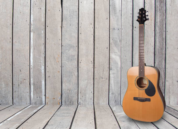 istock Wood floors, old rusty instruments shadow guitar clipingpart 1083222424