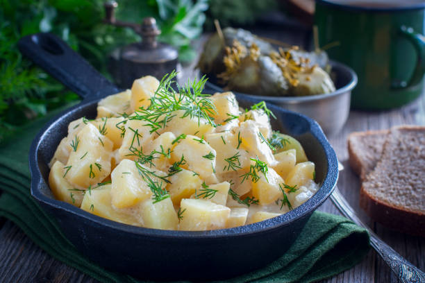 istock young potatoes cooked in sour cream in a cast iron pan, horizontal 1083227858