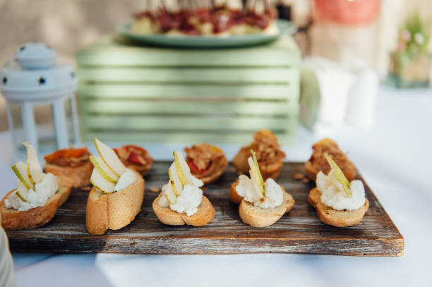 istock Delicious snacks on wedding reception table in luxury outdoor restaurant 1083230192