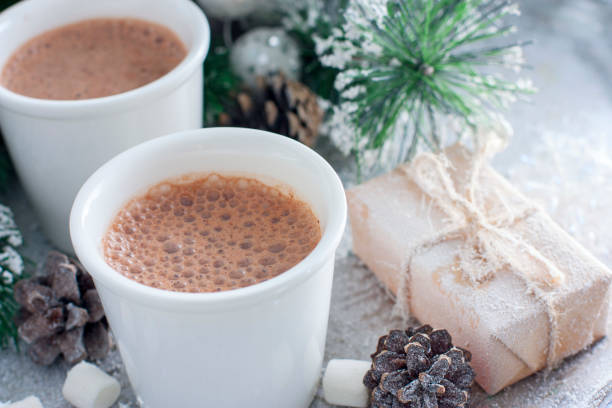 istock Hot chocolate in white glasses on a tray with New Year's decor, horizontal, copy space 1083230698