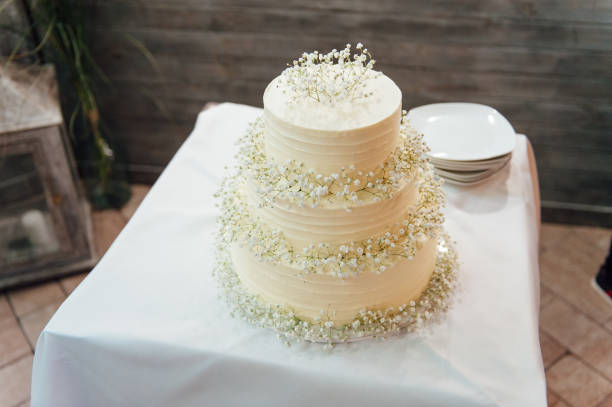 wedding cake three floors outside in the evening