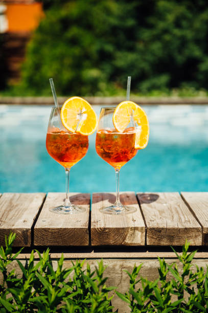 istock Two Glass of Spritz cocktail on the pool 1083235478