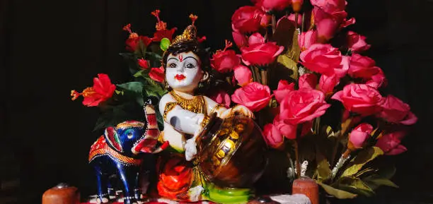 Photo of Small statue of Lord Krishna.Krishna is a major deity in Hinduism. He is worshipped as the eighth avatar of the god Vishnu and also as the supreme God in his own right.