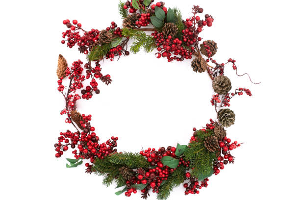 istock Christmas wreath composition on isolated white background. New year wrapped gift, pine cones, thuja or fir branches and red berries on snow. Top view, flat lay, copy space. Circular shape decoration. 1083237078