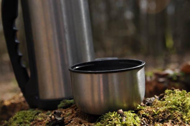 istock Hot tea in thermos for a walk in the woods while resting 1083237404
