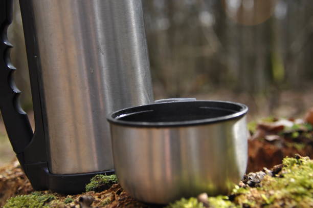 istock Hot tea in thermos for a walk in the woods while resting 1083237414