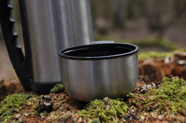 istock Hot tea in thermos for a walk in the woods while resting 1083237466