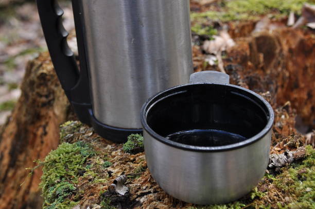istock Hot tea in thermos for a walk in the woods while resting 1083237550