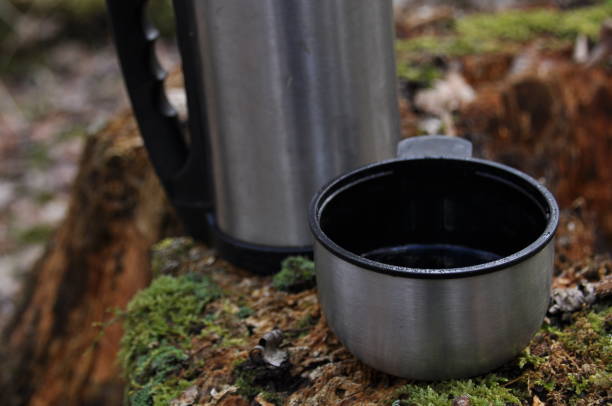 istock Hot tea in thermos for a walk in the woods while resting 1083237578