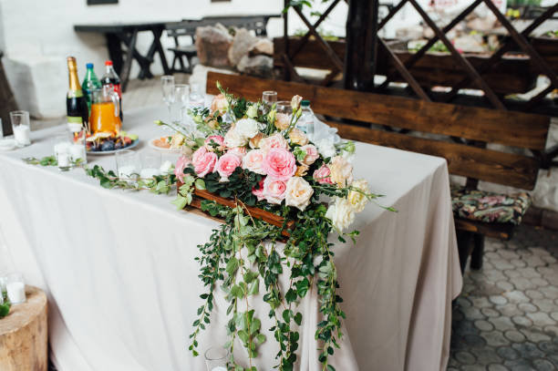 istock Rustic wedding decor on a timber background. Main table setting for bride and groom newlyweds 1083239258