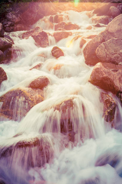 istock Fast moving water coming down the mountains 1083240042