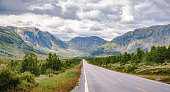 istock The Road Ahead through the Majestic Mountain-range of Norway 1083241218