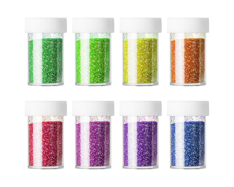 Colorful of glitter bottle isolated on white background. Fashion powder for makeup or decorations. ( Clipping path )
